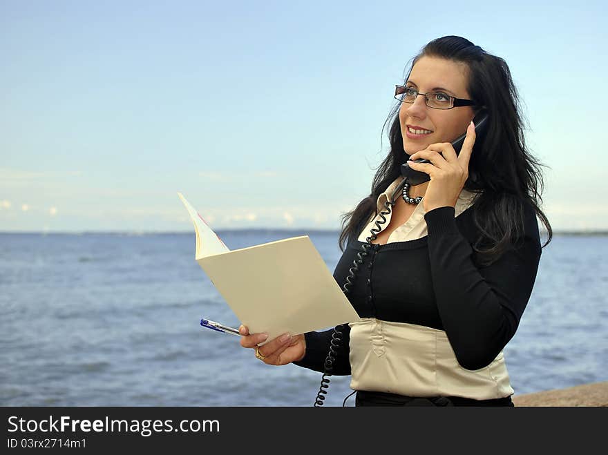 Girl with a telephone receiver in hand