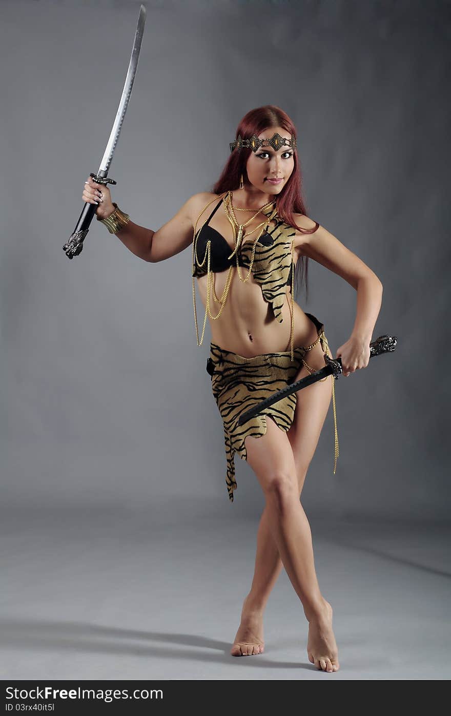 Warrior woman holding sword in her hand