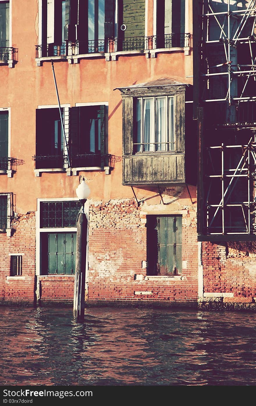 Antique balcony and historic building in Venice