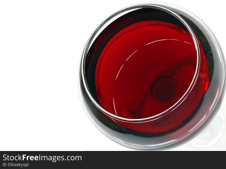 Glass of red wine over white with space for text