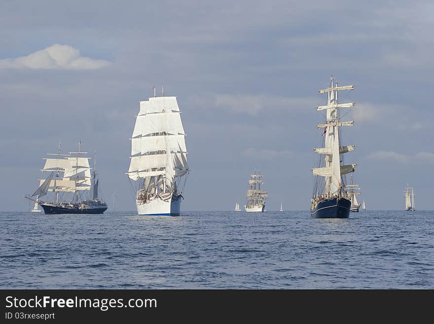 Several tall ships in a row before start a regatta. Several tall ships in a row before start a regatta