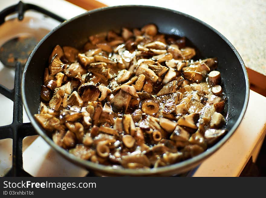 Grilled black mushrooms in skillet