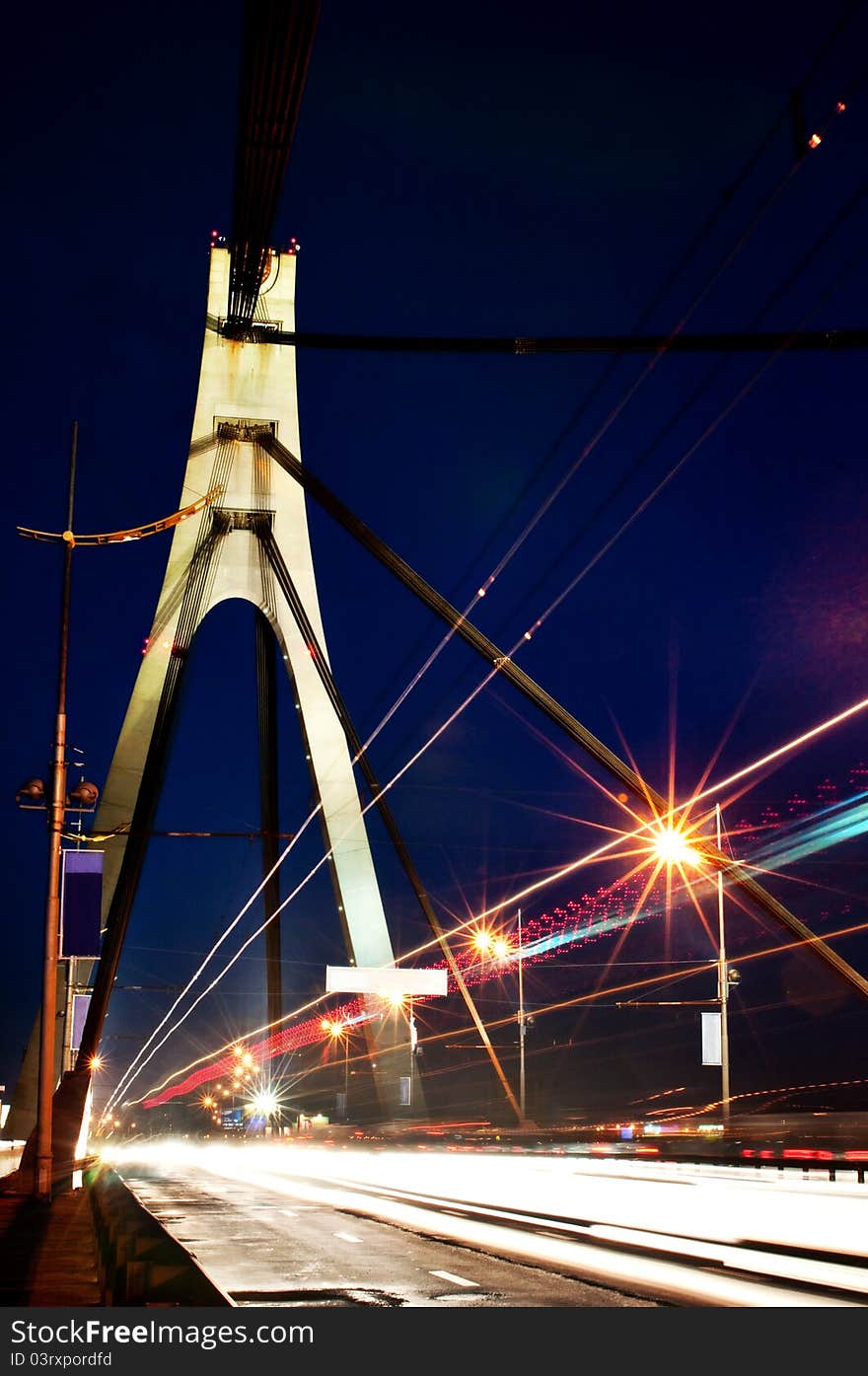 Night traffic on the city bridge at dusk. Night traffic on the city bridge at dusk