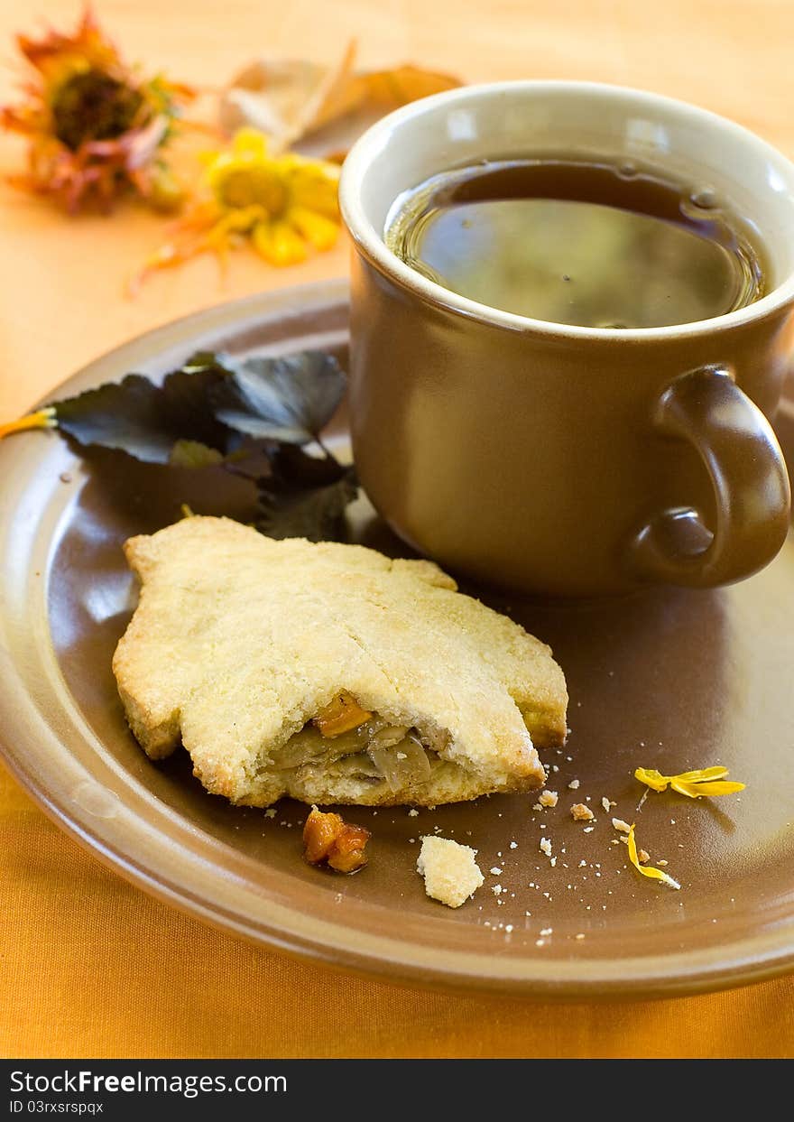 Vegetable or meat pie with cup of tea. Selective focus. Vegetable or meat pie with cup of tea. Selective focus