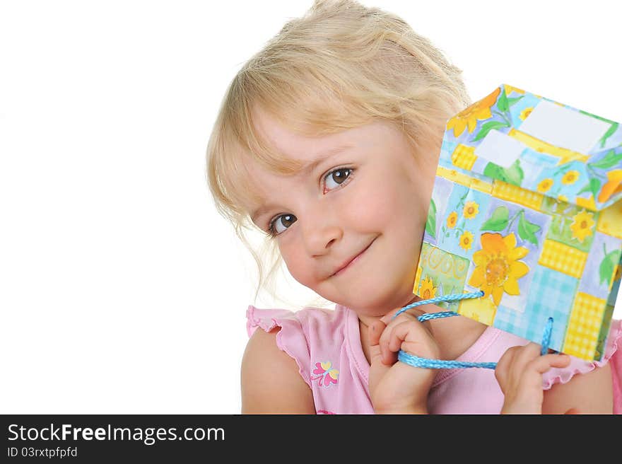 Little cute girl with present posing to camera