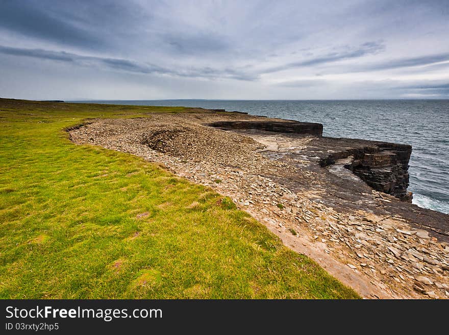 Ireland, cliffs under dramatic sky, Loop Head