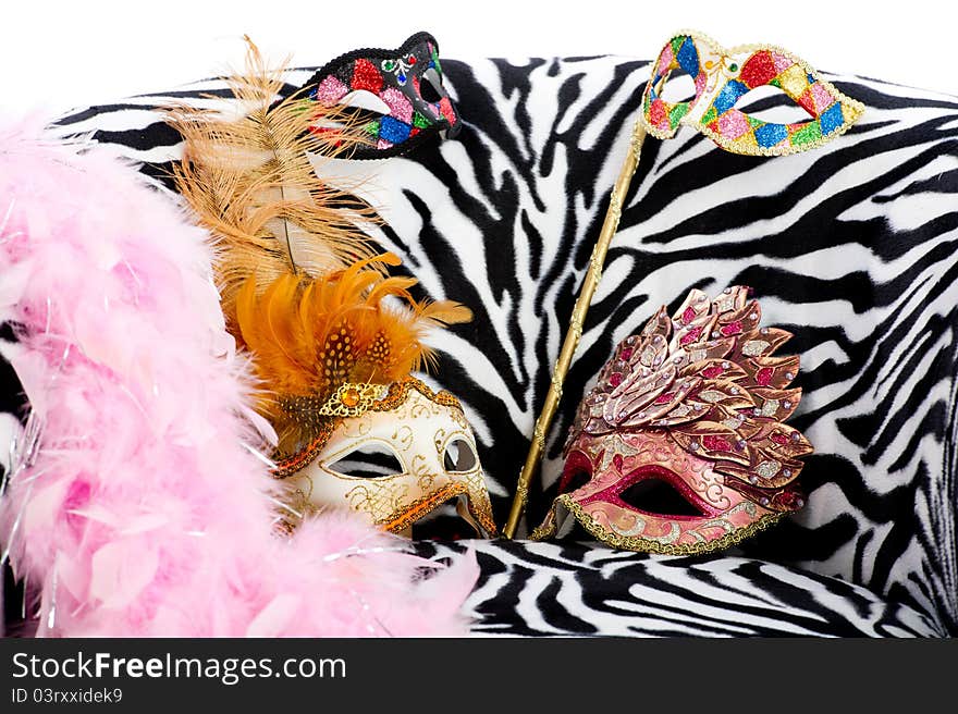 Image shoeing brightly coloured masquerade masks on retro style chair. Image shoeing brightly coloured masquerade masks on retro style chair