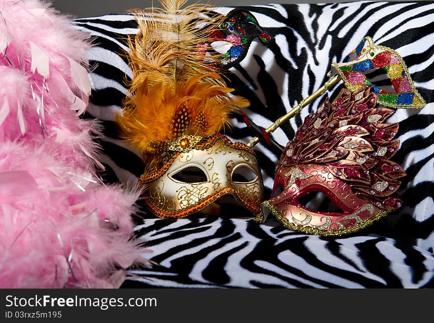 Image shoeing brightly coloured masquerade masks on retro style chair. Image shoeing brightly coloured masquerade masks on retro style chair