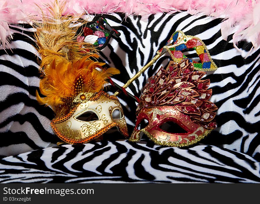 Image shoeing brightly coloured masquerade masks on retro style chair. Image shoeing brightly coloured masquerade masks on retro style chair