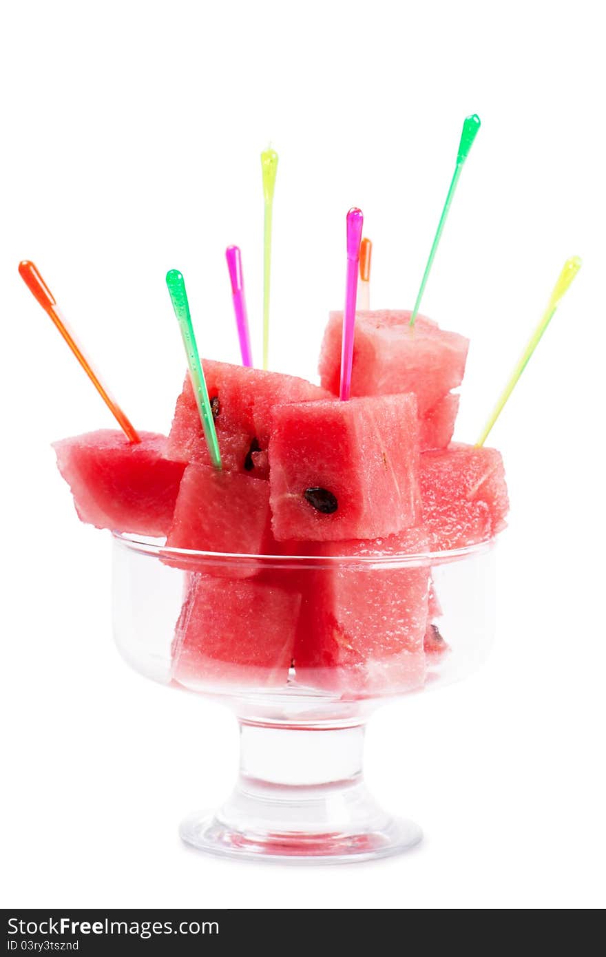 Macro view of fresh watermelon pieces in a glass bowl