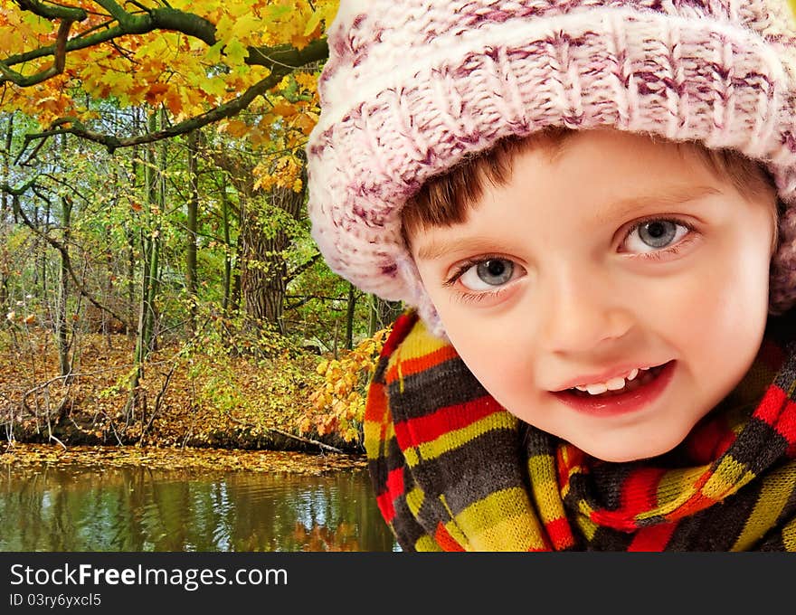 Little girl in autumn forest