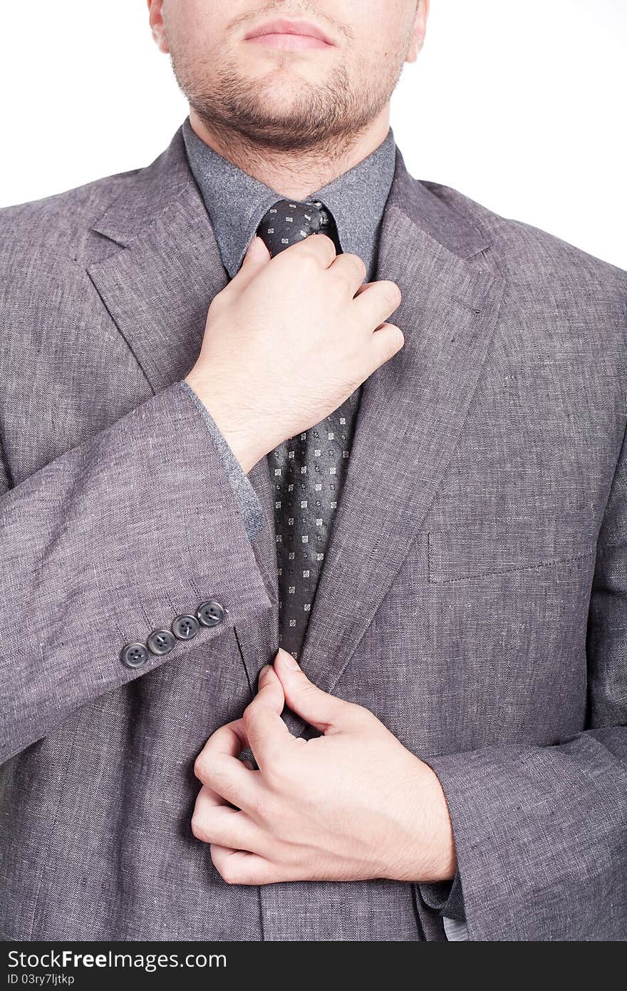 Businessman fixing his tie