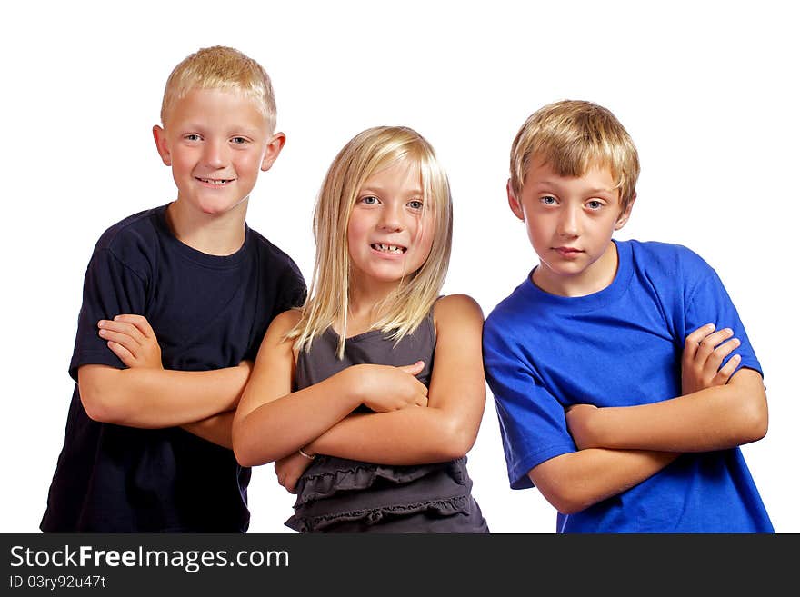 Three friends with arms crossed posing for the camera. Three friends with arms crossed posing for the camera