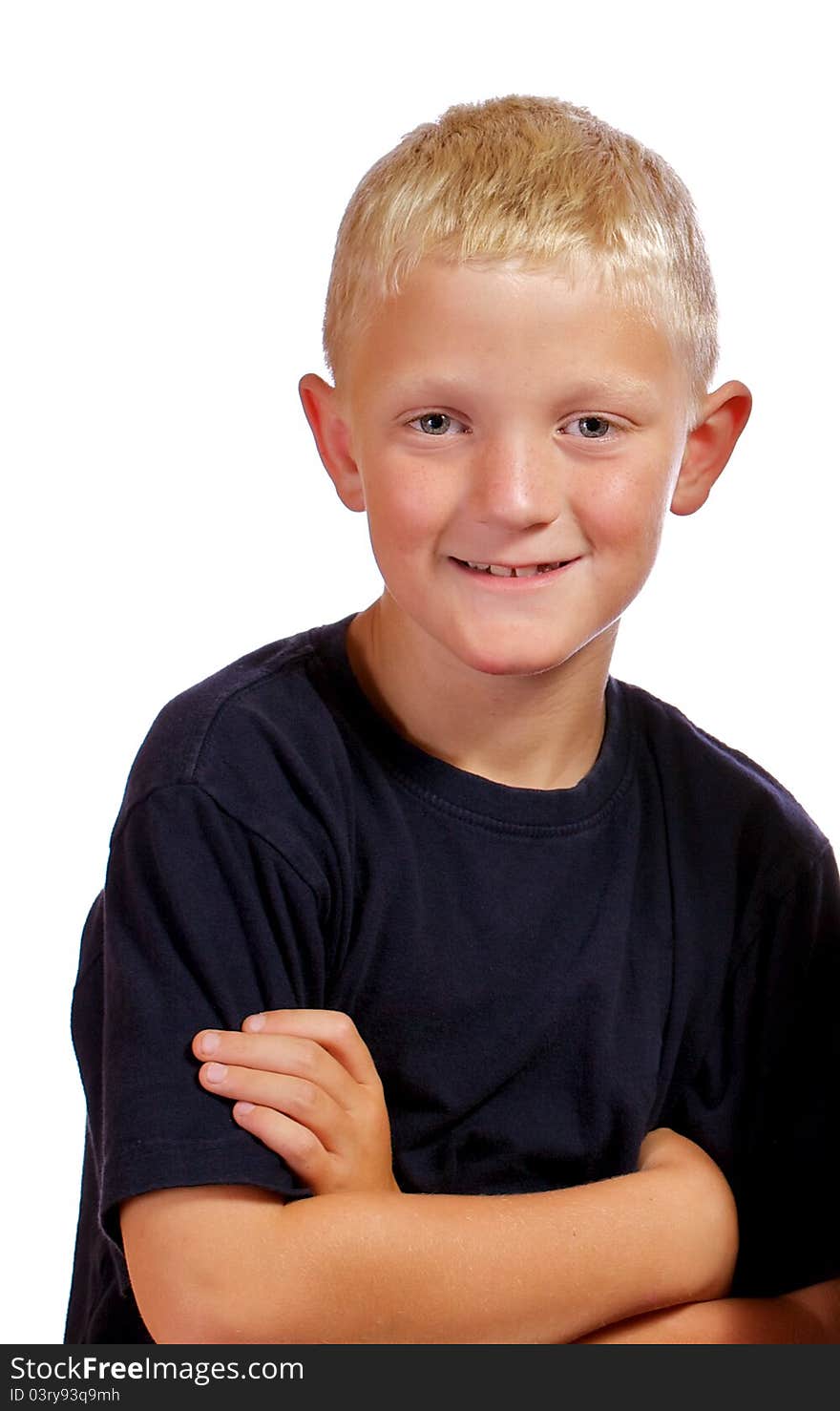 Boy with arms crossed smiling and posing for the camera. Boy with arms crossed smiling and posing for the camera