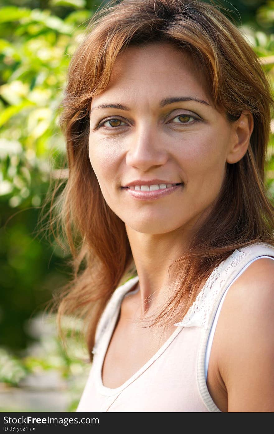 Close up portrait of beautiful caucasian woman in park. Close up portrait of beautiful caucasian woman in park