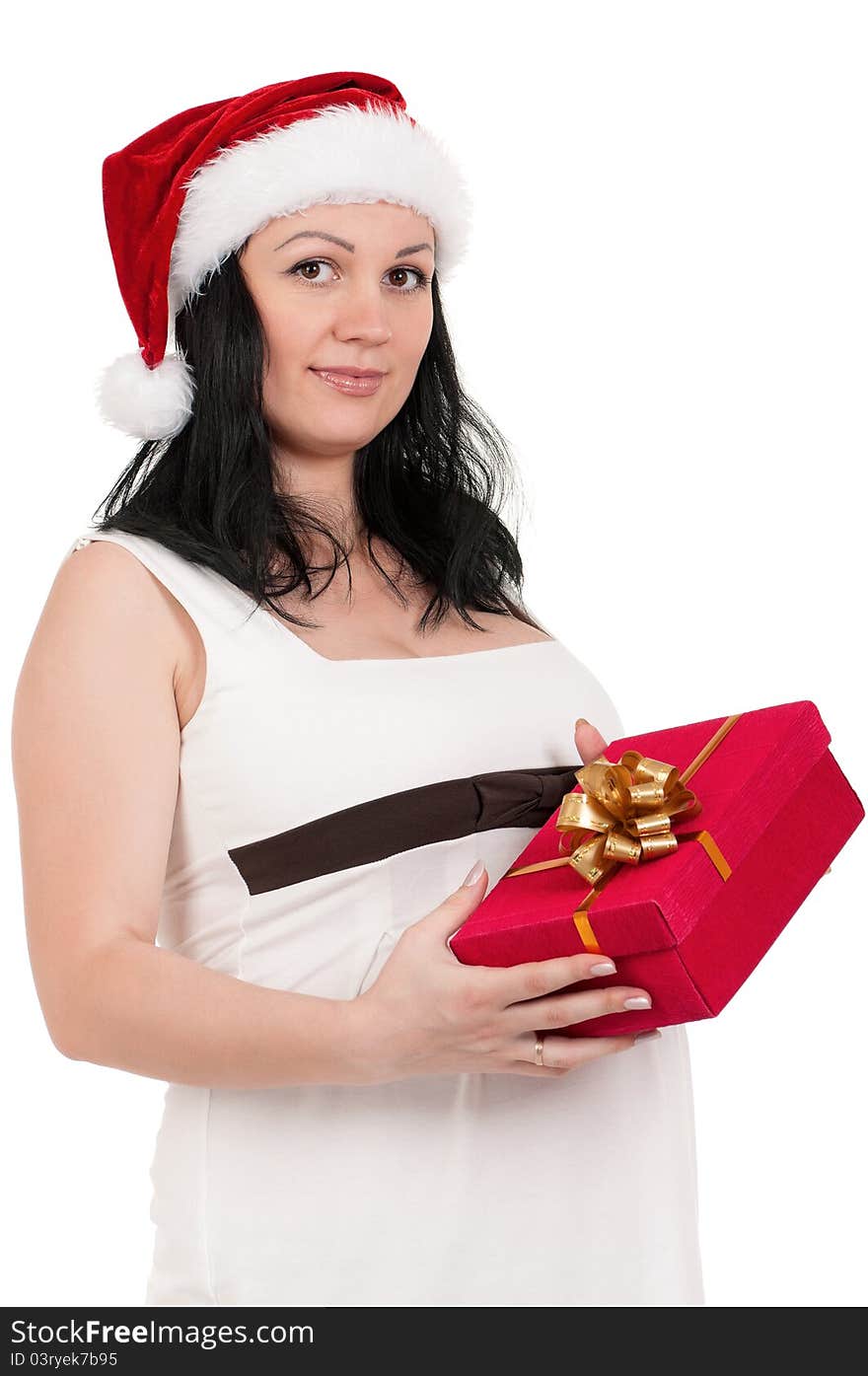 Portrait of a pregnant woman in santa hat with gift box over white background. Third trimester. Portrait of a pregnant woman in santa hat with gift box over white background. Third trimester.