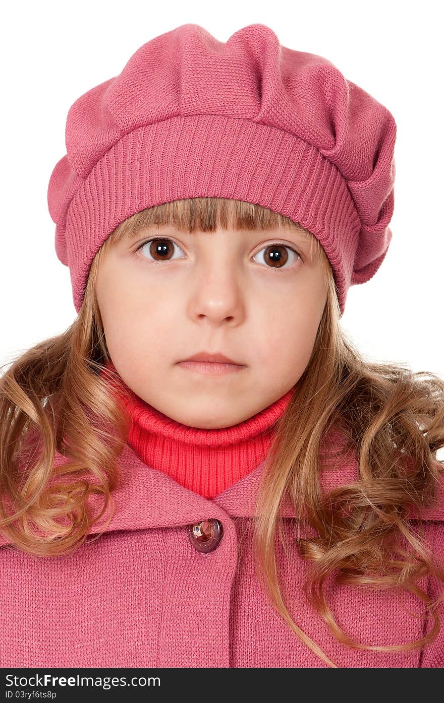 Portrait of a pretty little girl in sweater on white background