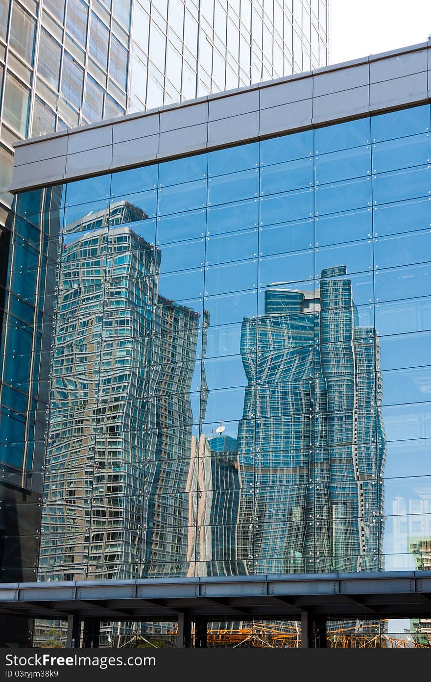 Modern building reflection in the glass wall