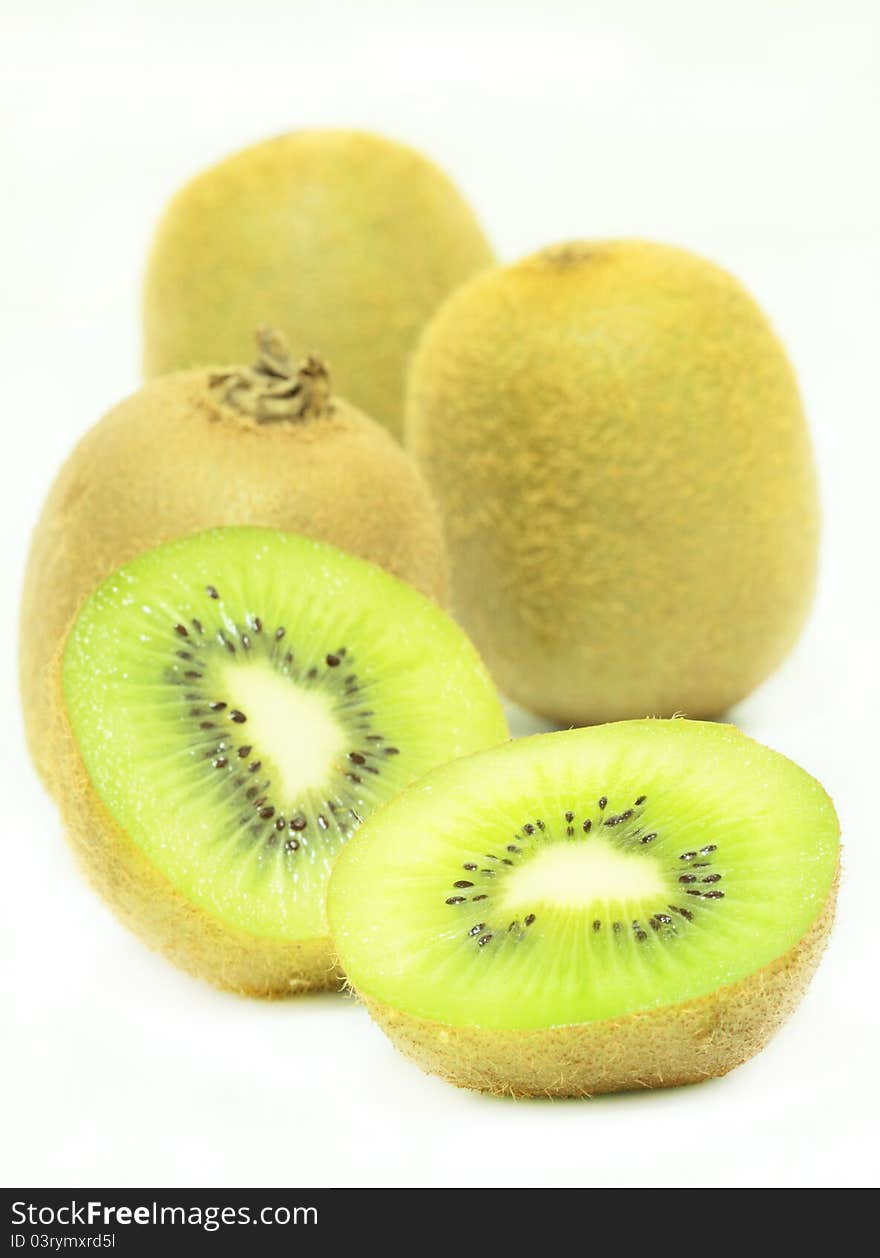 Whole and sliced kiwi on white background. Whole and sliced kiwi on white background