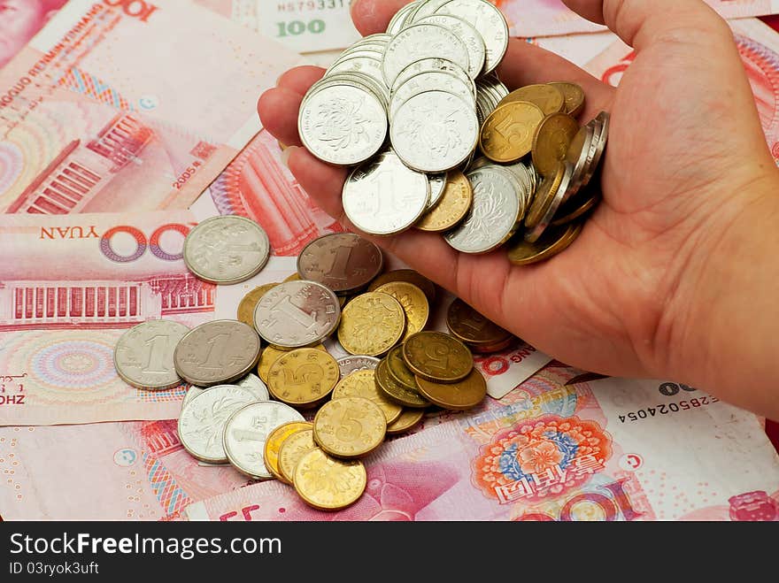 China's yuan, and a pile of coins, for financial material. China's yuan, and a pile of coins, for financial material