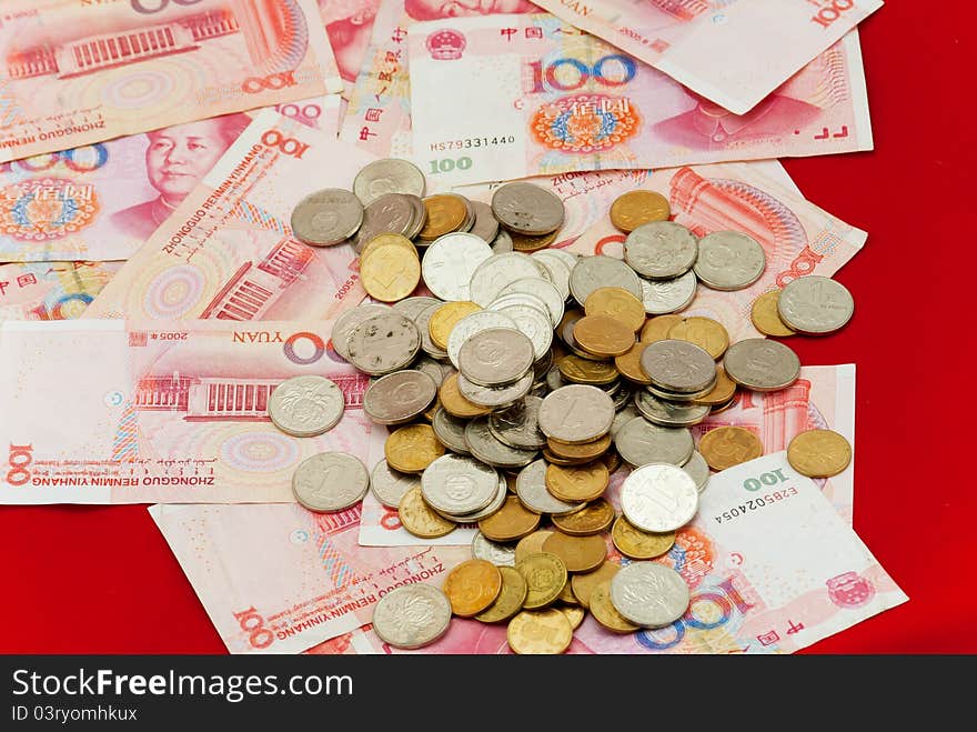 China's yuan, and a pile of coins, for financial material. China's yuan, and a pile of coins, for financial material