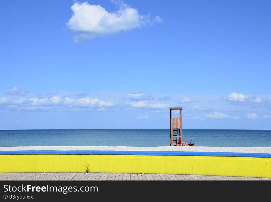 Italian sea side with watching place and yellow fence. Italian sea side with watching place and yellow fence