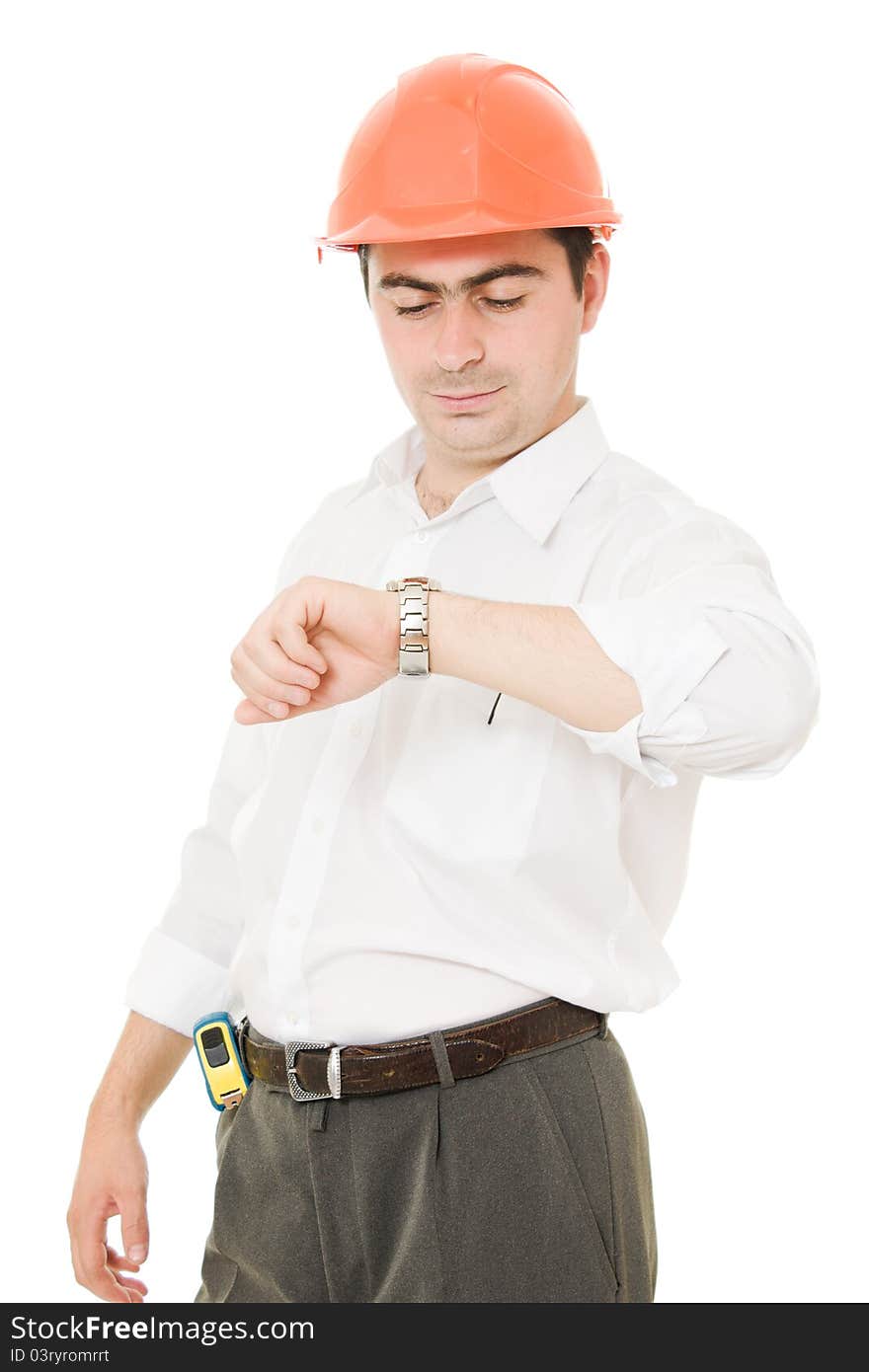 Businessman in helmet looks at his watch. Businessman in helmet looks at his watch.