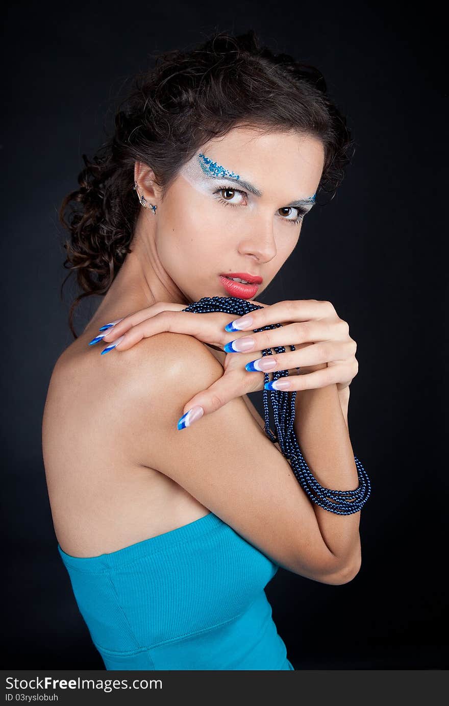 Beautiful woman with carly dark hair and long acrylic nails