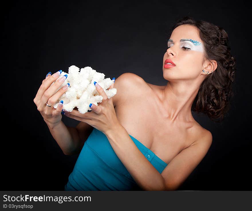 Beautiful woman with carly dark hair and long acrylic nails