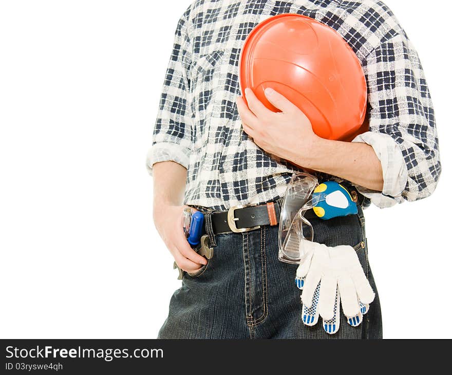 A worker with helmet in hand, and tools. A worker with helmet in hand, and tools.