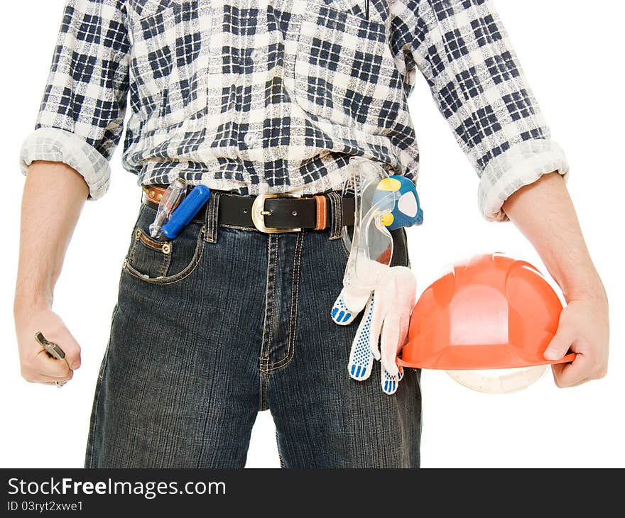 A worker with helmet in hand, and tools. A worker with helmet in hand, and tools.