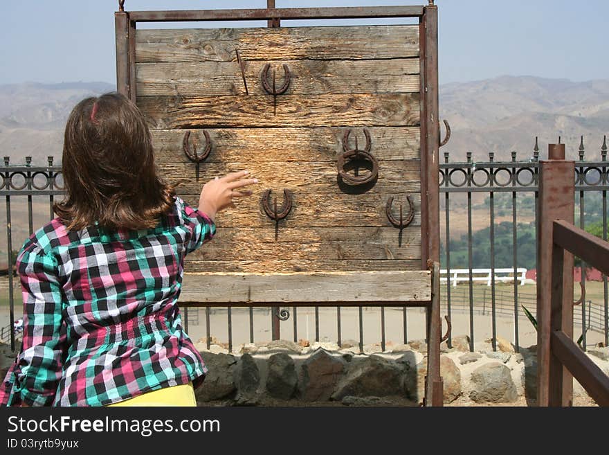 Girl Playing Horseshoes