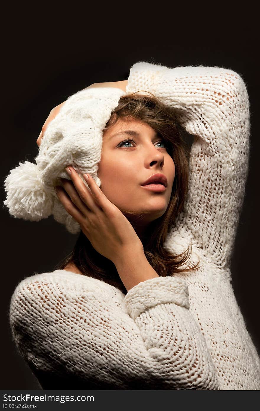 Girl in white wool and cap