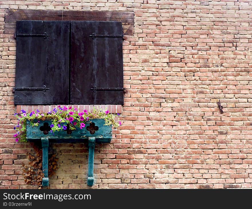 An Ancient Rural Wood Window with Flowers. An Ancient Rural Wood Window with Flowers