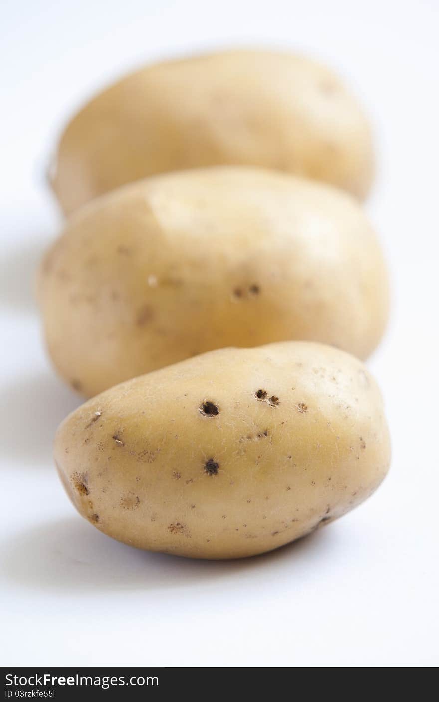 Bunch of potatoes on white background