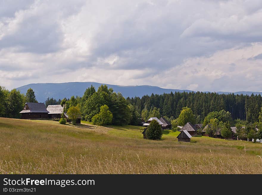 Photo of the traditional slovak village with a few timbers and greenery around