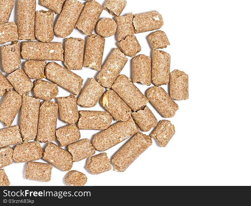 Wheatfeed pellets on white background