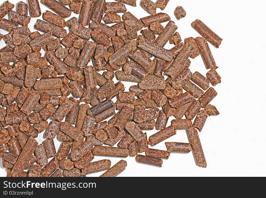 Cocoa shell pellets on white background