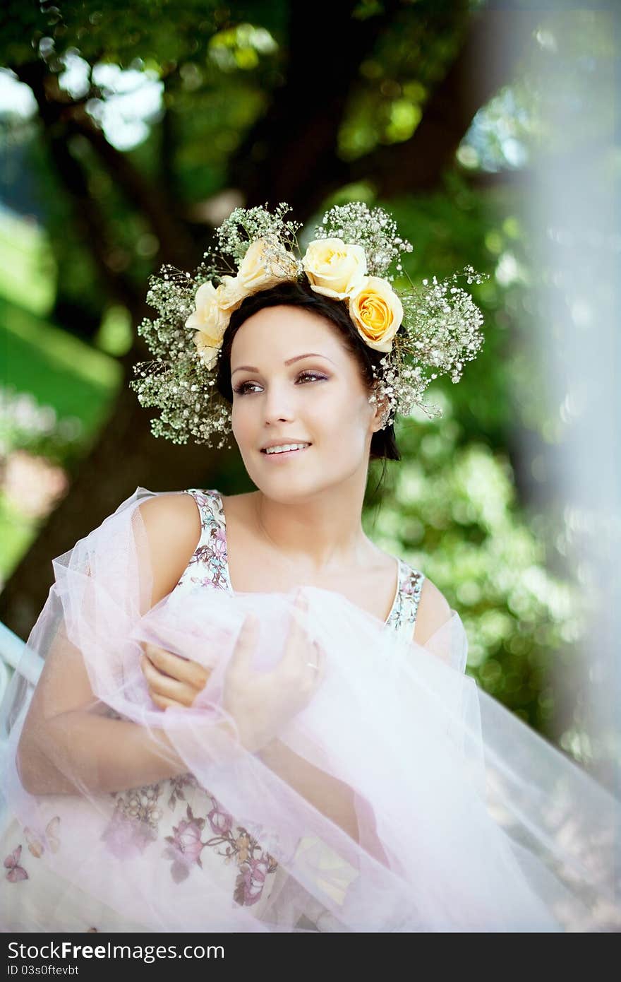 Beautiful Woman With A Wreath Of Roses