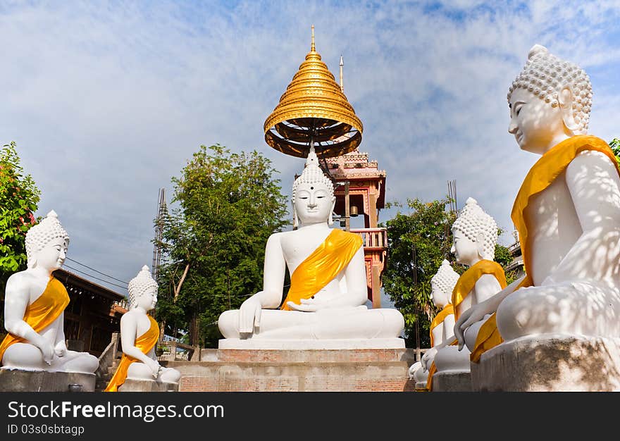 White  Buddha statue with blue sky