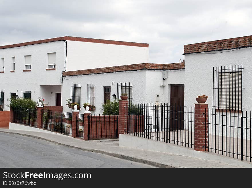 Street houses with courtyards decorated with potted plants in the Spanish town of Vejer de la Frontera located in Spain