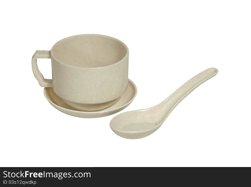 Image of a melamin cup, saucer and spoon isolated on a white background. Clipping path included. Image of a melamin cup, saucer and spoon isolated on a white background. Clipping path included.