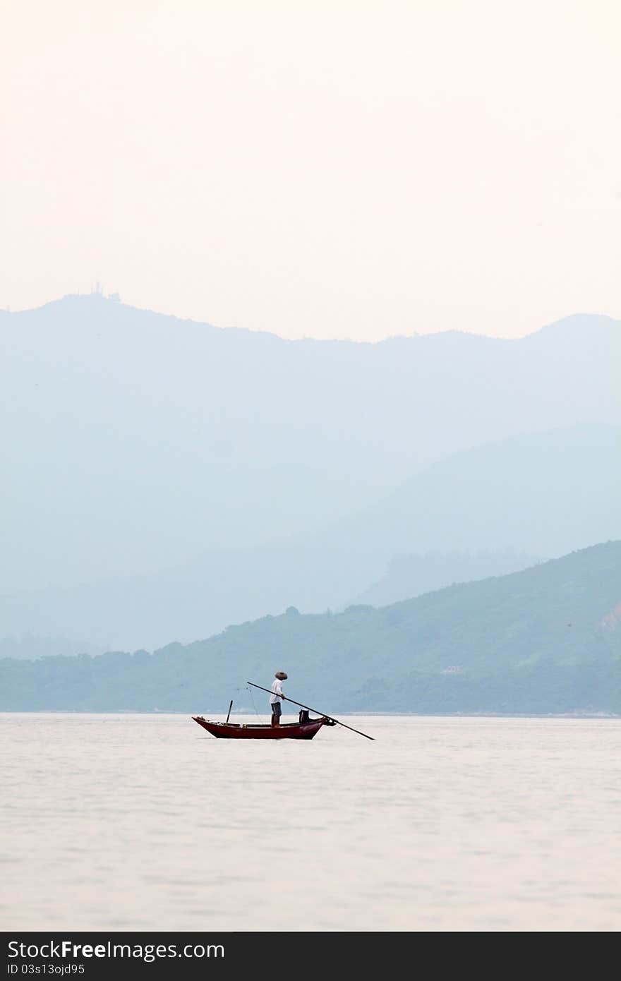 Fisherman over the ocean