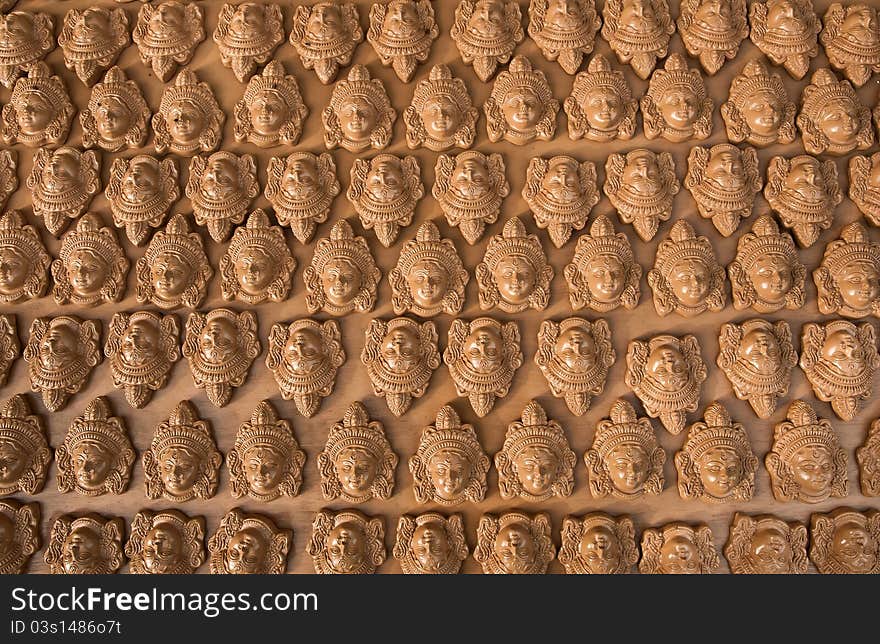 Many clay heads of Goddess Durga arranged for sale for the Dussera festival of Hindu religion. Many clay heads of Goddess Durga arranged for sale for the Dussera festival of Hindu religion