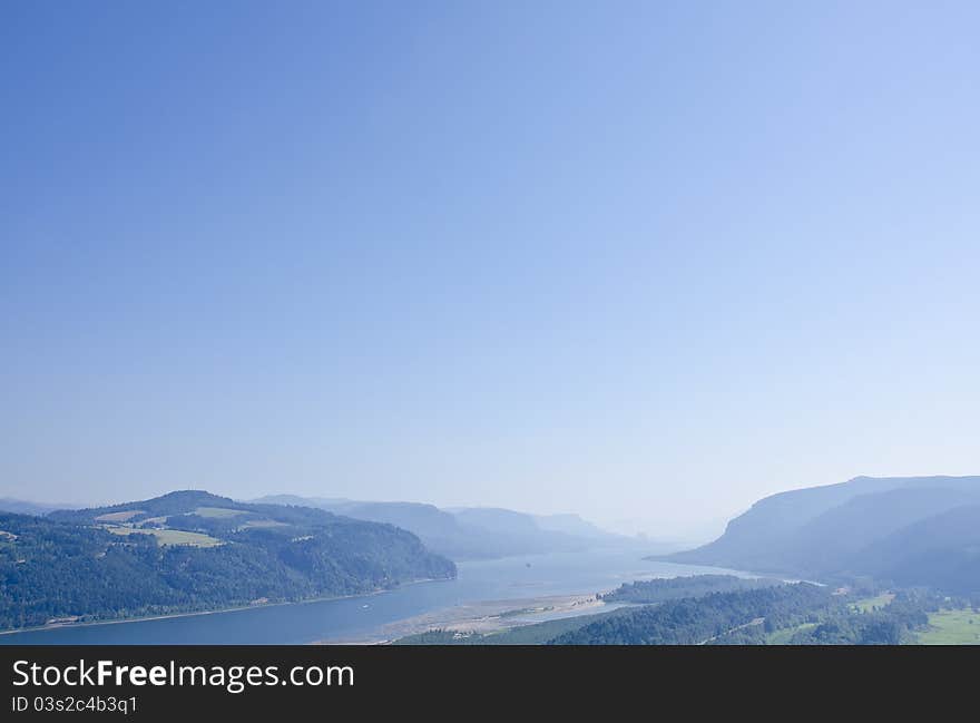 Columbia River Gorge and light blue sky. Columbia River Gorge and light blue sky.