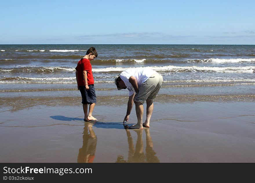 Father and son on beach