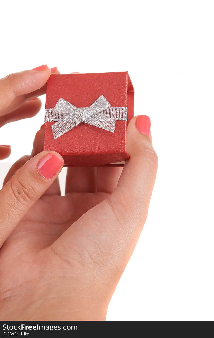 Woman holding beautiful gift, isolated over white