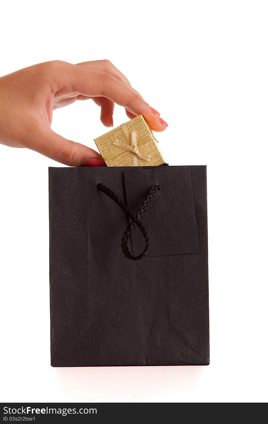 Woman holding beautiful gift, isolated over white