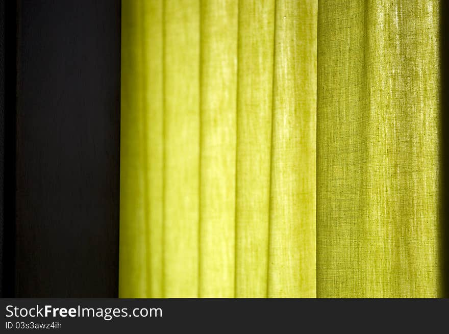 Green curtain with natural window light background image. Green curtain with natural window light background image