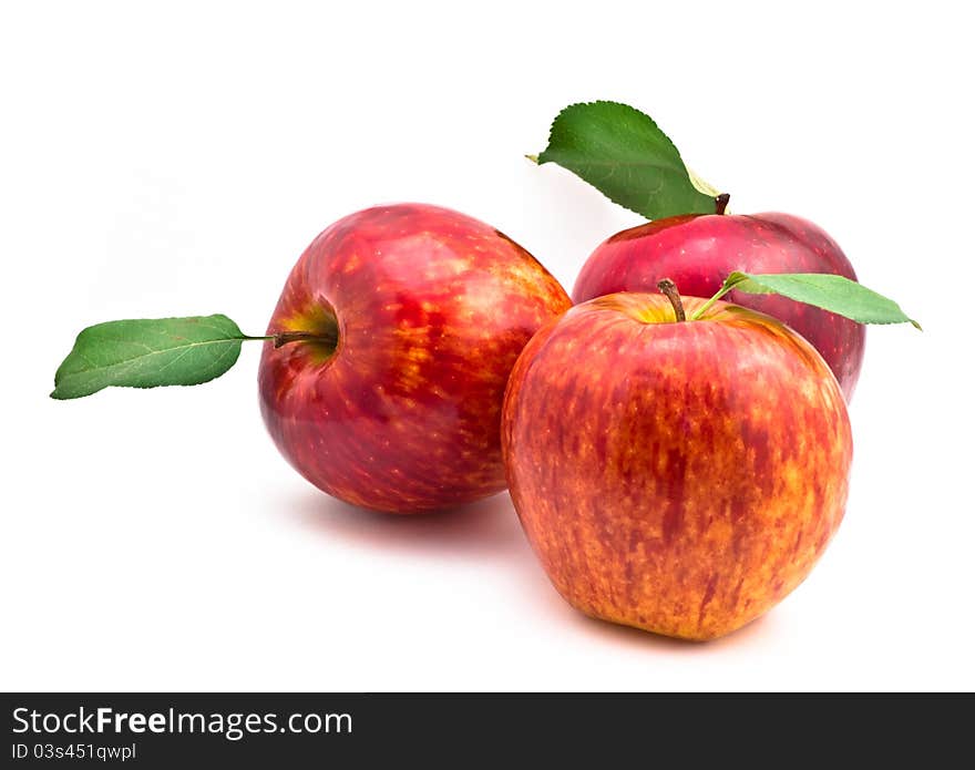 Red Apples with leaf on white background